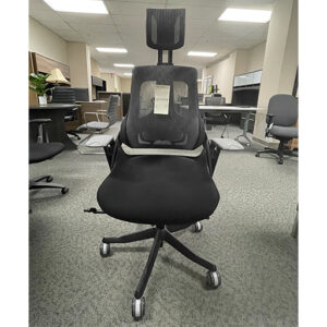 Black executive chair with headrest in showroom