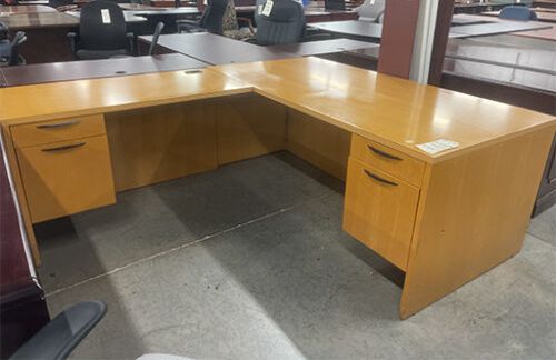 L-shaped wooden desk with drawers