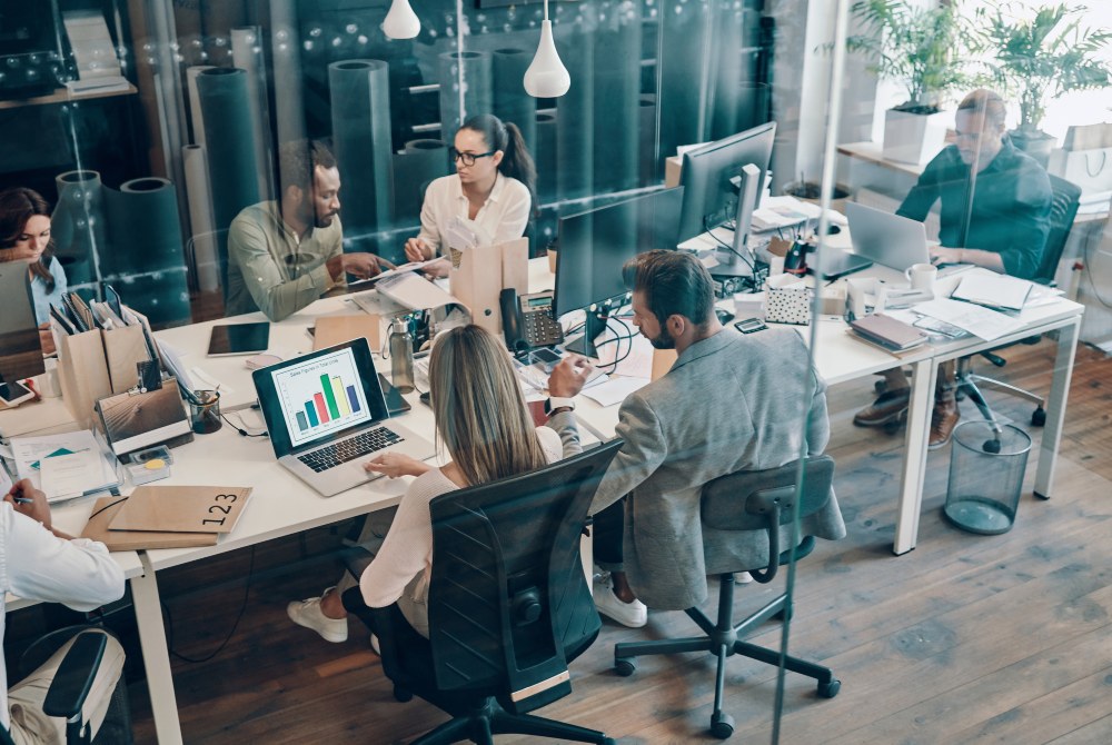 Marketing team in meeting room going over strategy