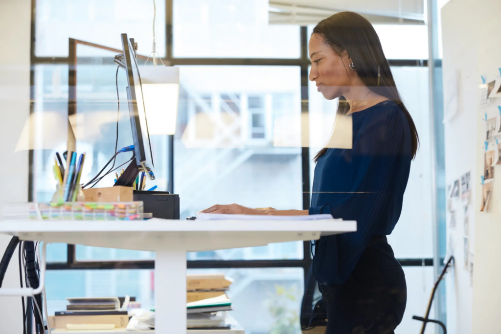 Businesswoman working on site-to-stand desk