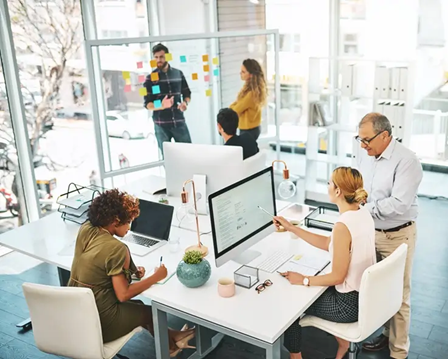 Co-workers collaborating in small Atlanta office