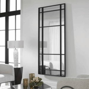 Modern mirror UTTEROFESPURGEONXPO in the living room reflects the decor in Atlanta, GA