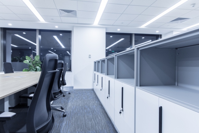 A Modern Office with White, Lockable Storage Cabinets and Desks by Office Furniture Expo