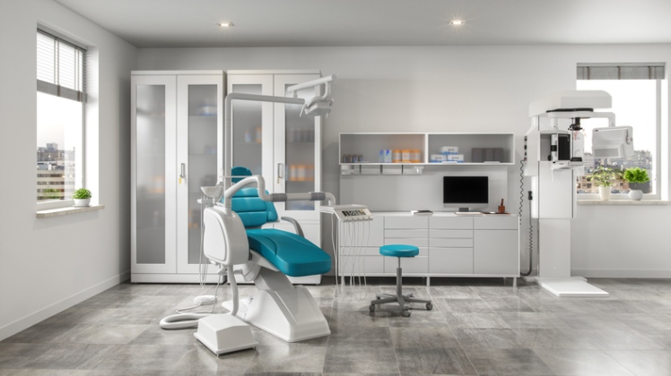 Modern dental surgery room with ergonomic chair and medical equipment setup